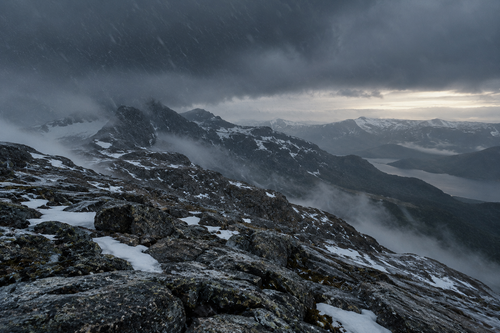 Northern Exposure: a storm closing over snow-dusted granite peaks